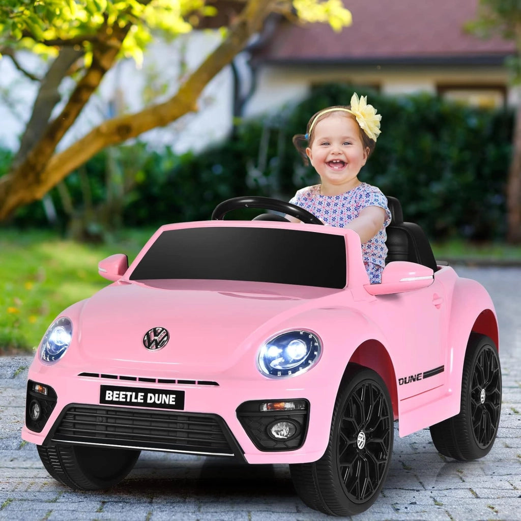 12V Volkswagen Macchina Elettrica per Bambini, Auto Elettrica con Telecomando Luci Musica Doppia Porta, 5km/h Carico 30kg, per Bambini 3-8 Anni (Rosa)