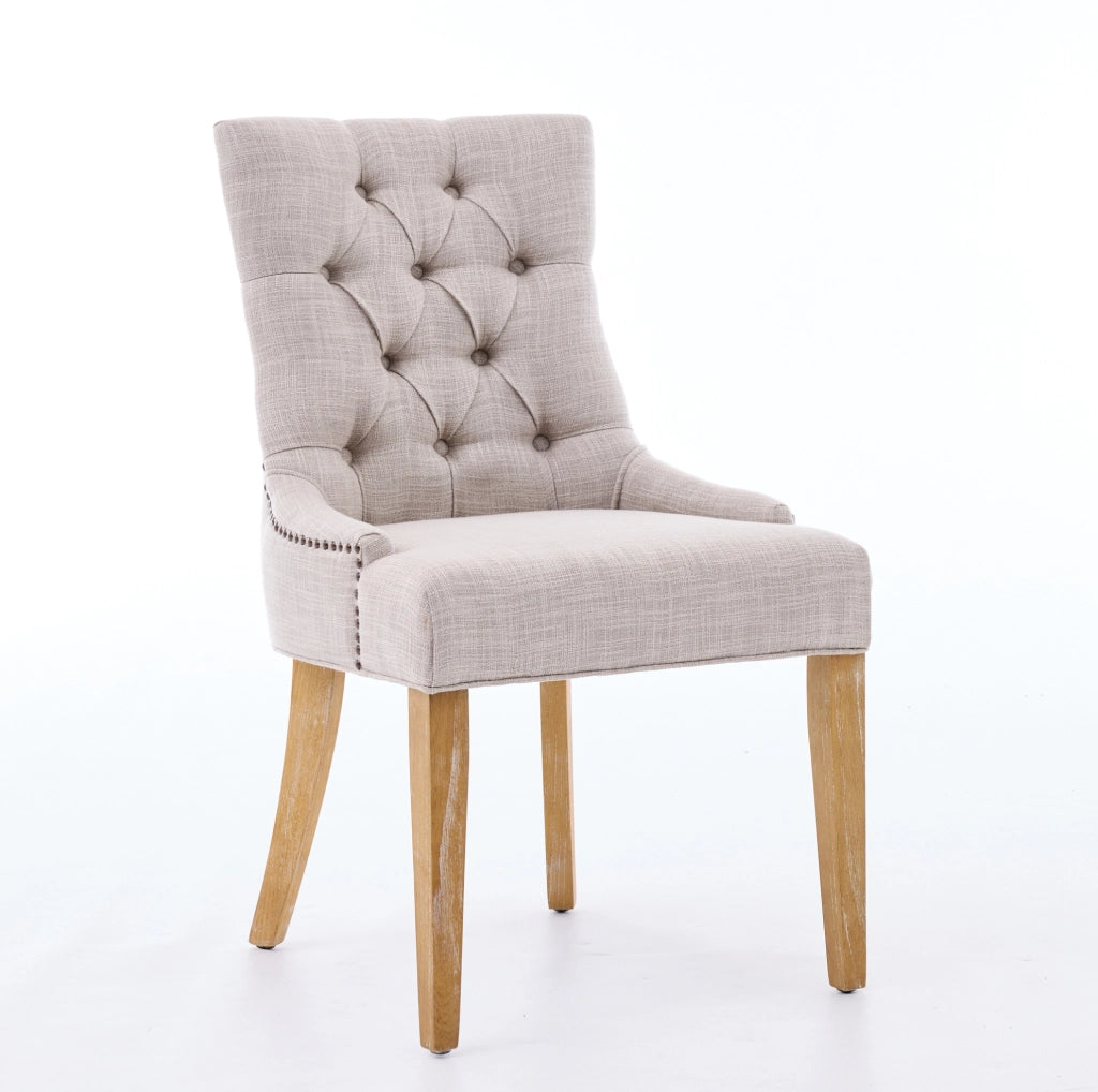 Set di 2 sedie da pranzo imbottite in tessuto con gambe in rovere e borchie decorative