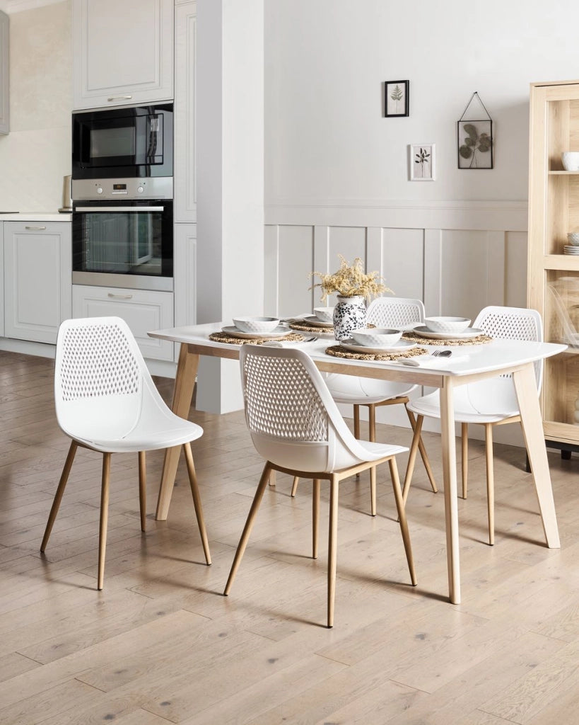 Set di 4 sedie da pranzo Seduta sintetica bianca Gambe in metallo Seduta moderna semplice e minimalista