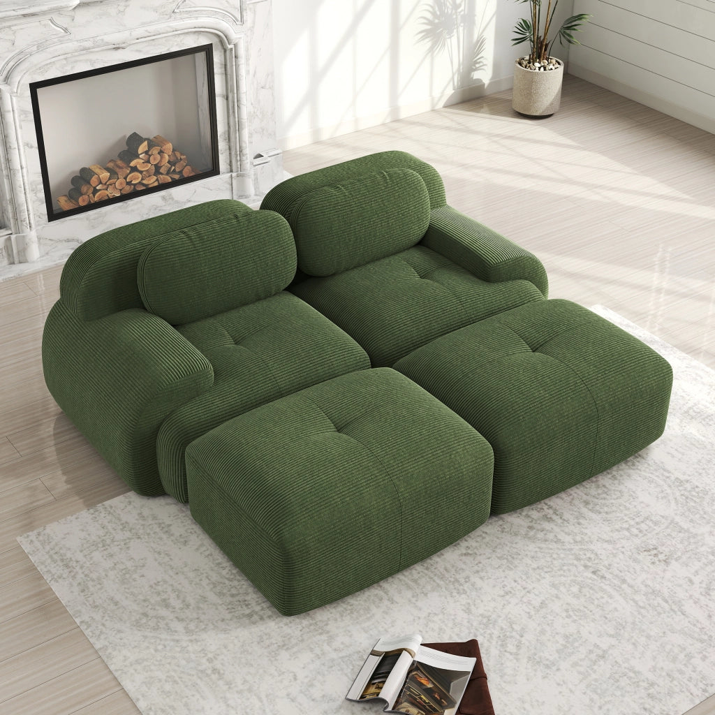 Divano angolare modulare senza struttura in tessuto a coste con braccioli ergonomici e base antiscivolo verde