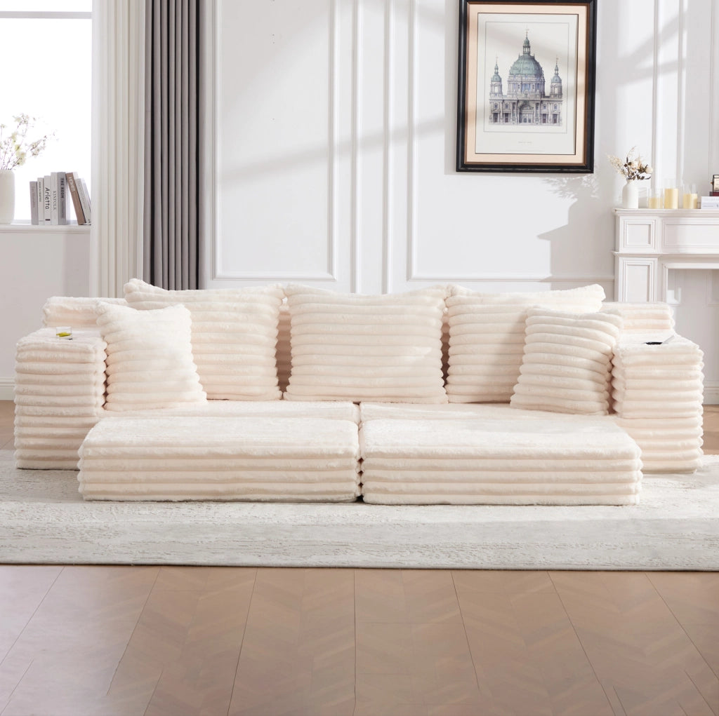 Divano modulabile in velluto a coste beige con tasche laterali e portabevande