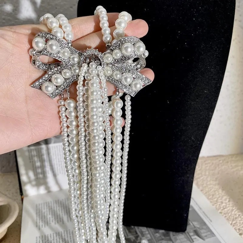 Collana con fiocco doppio strato e nappa di perle, realizzata a mano, regalo di Natale o di compleanno.