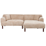 Divano ad angolo sinistro in tessuto beige lato sinistro e gambe in legno stile minimalista