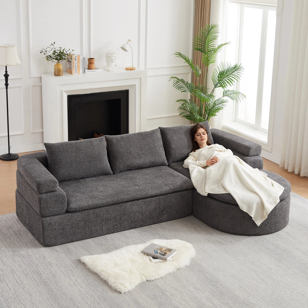 Divano angolare con chaise longue in chenille con bracciolo a gradini e schienali imbottiti grigio antracite