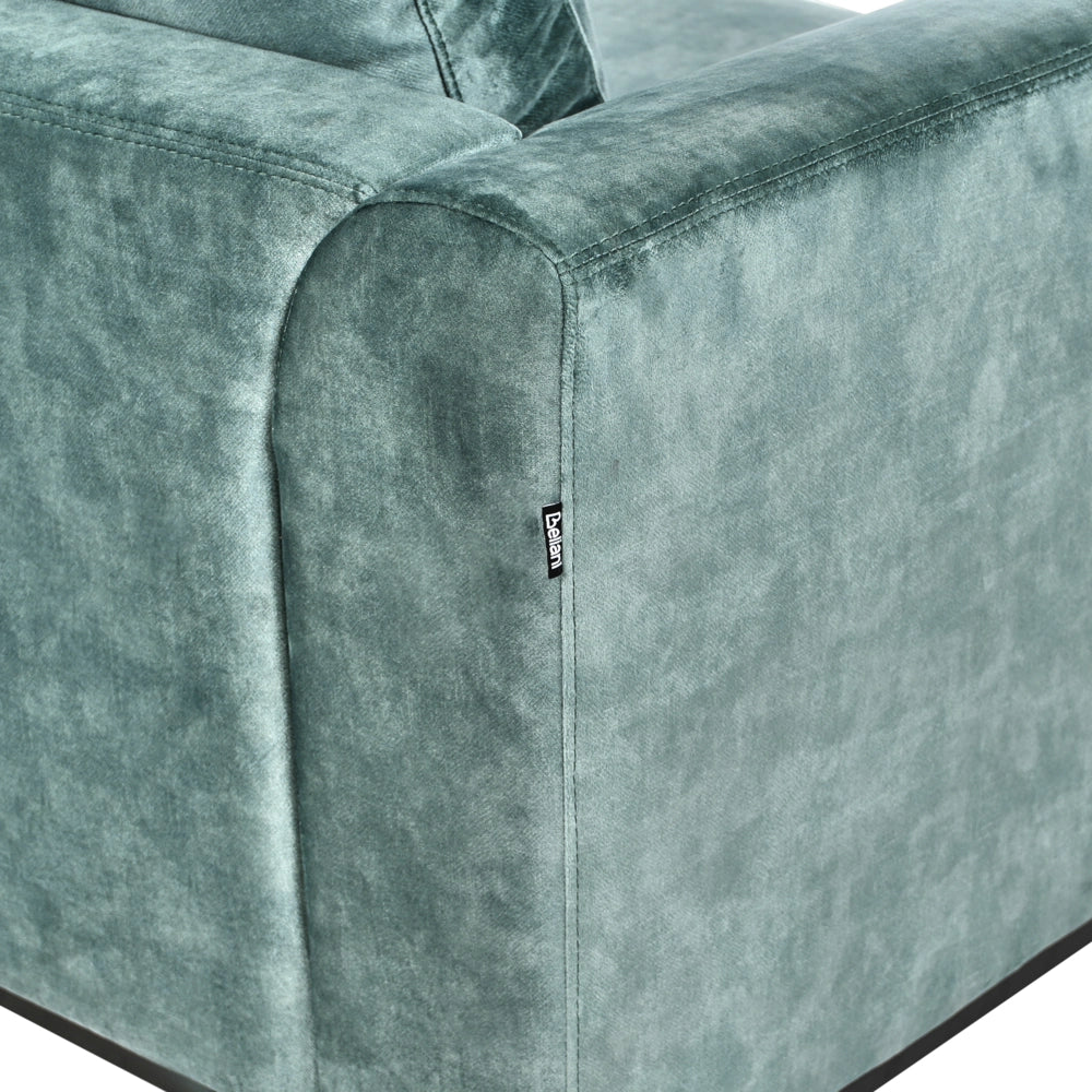 Divano angolare con pouf a forma di L in velluto verde acqua idrorepellente e gambe d'acciaio lato destro stile moderno
