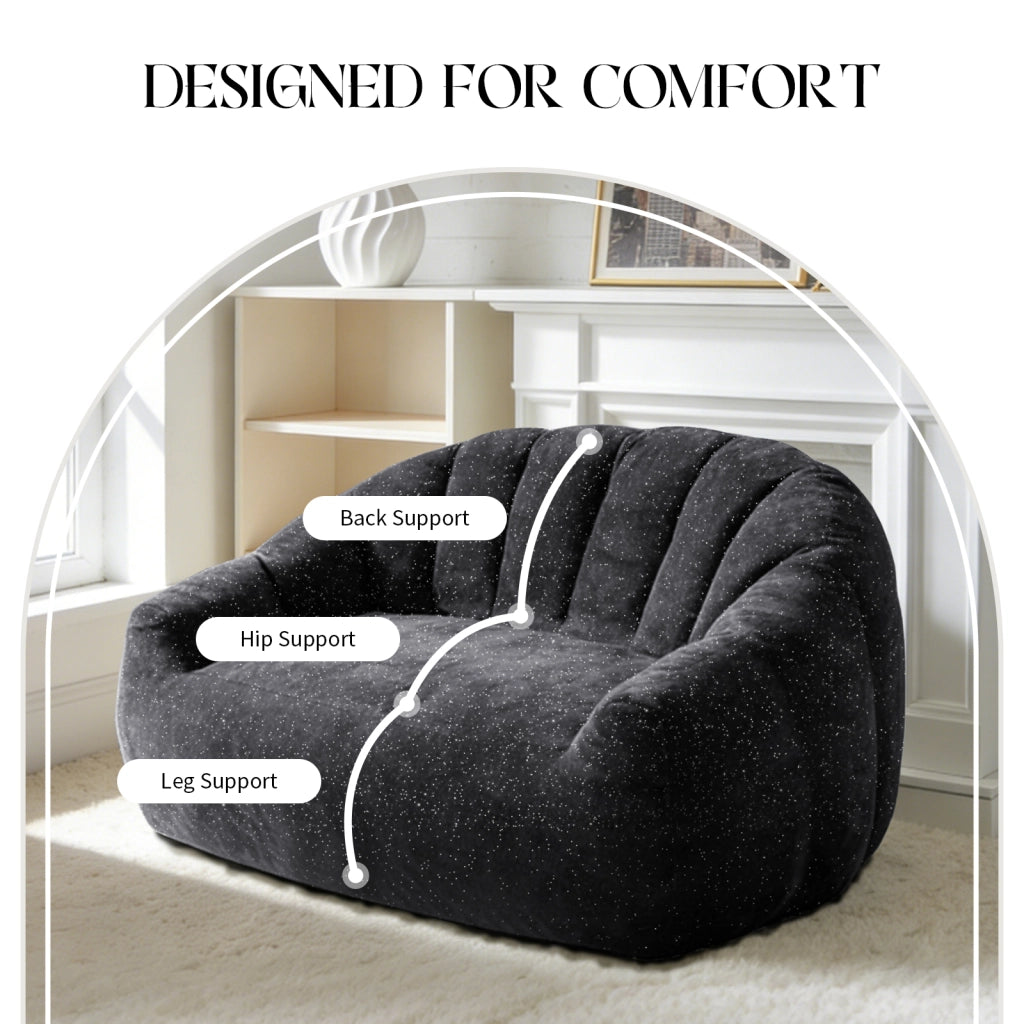 Fauteuil pouf con design a zampa d'orso e seduta ampia in flanella nera per soggiorno, camera da letto e zona relax