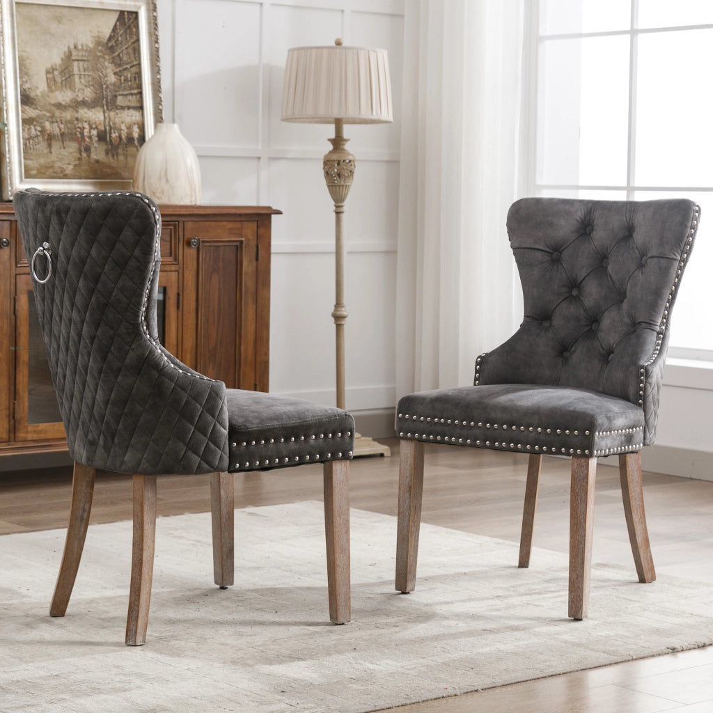 Sedia da pranzo imbottita con gambe regolabili, borchie decorative e anello posteriore, in velluto grigio