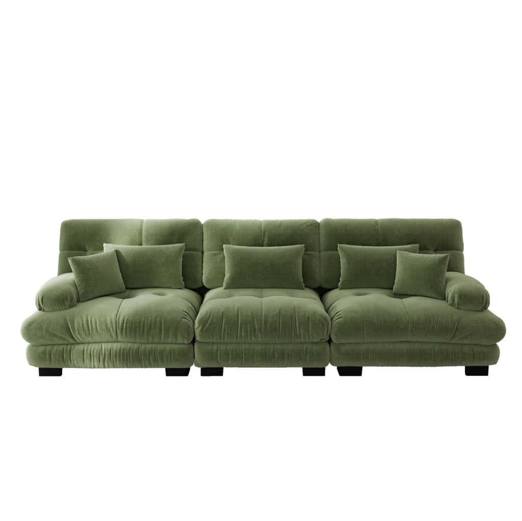 Divano modulare in chenille verde con seduta profonda e braccioli imbottiti arrotondati