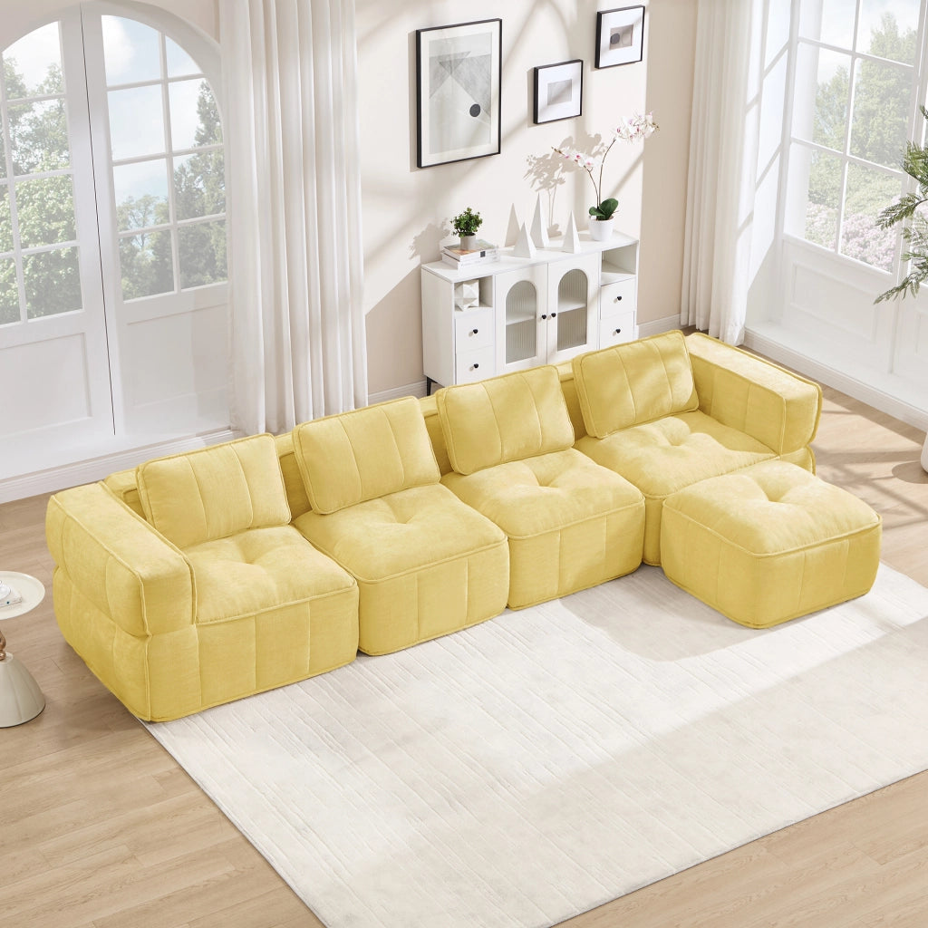 Divano modulare ad angolo senza struttura con pouf, seduta profonda e rivestimento in poliestere giallo per soggiorno