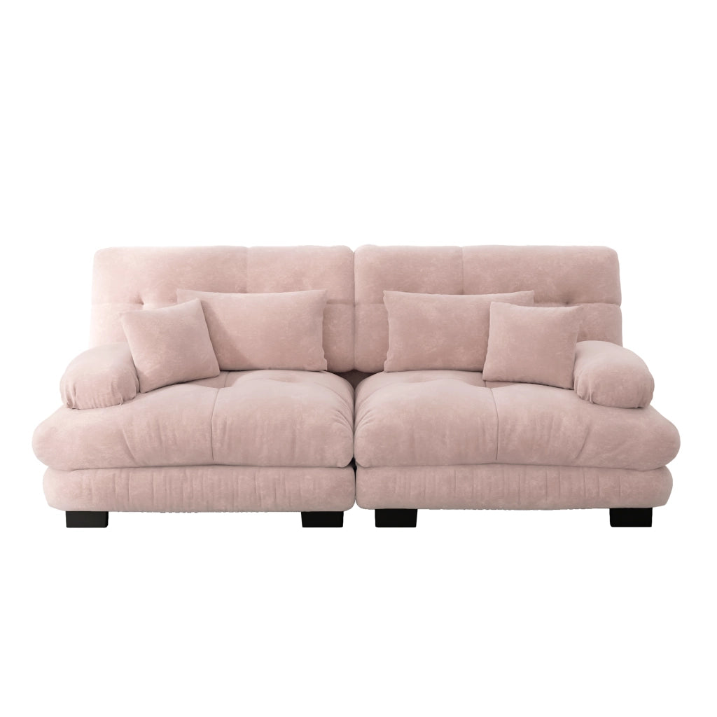 Divano angolare modulare con seduta profonda braccioli imbottiti cuscini lombari e decorativi in ciniglia rosa