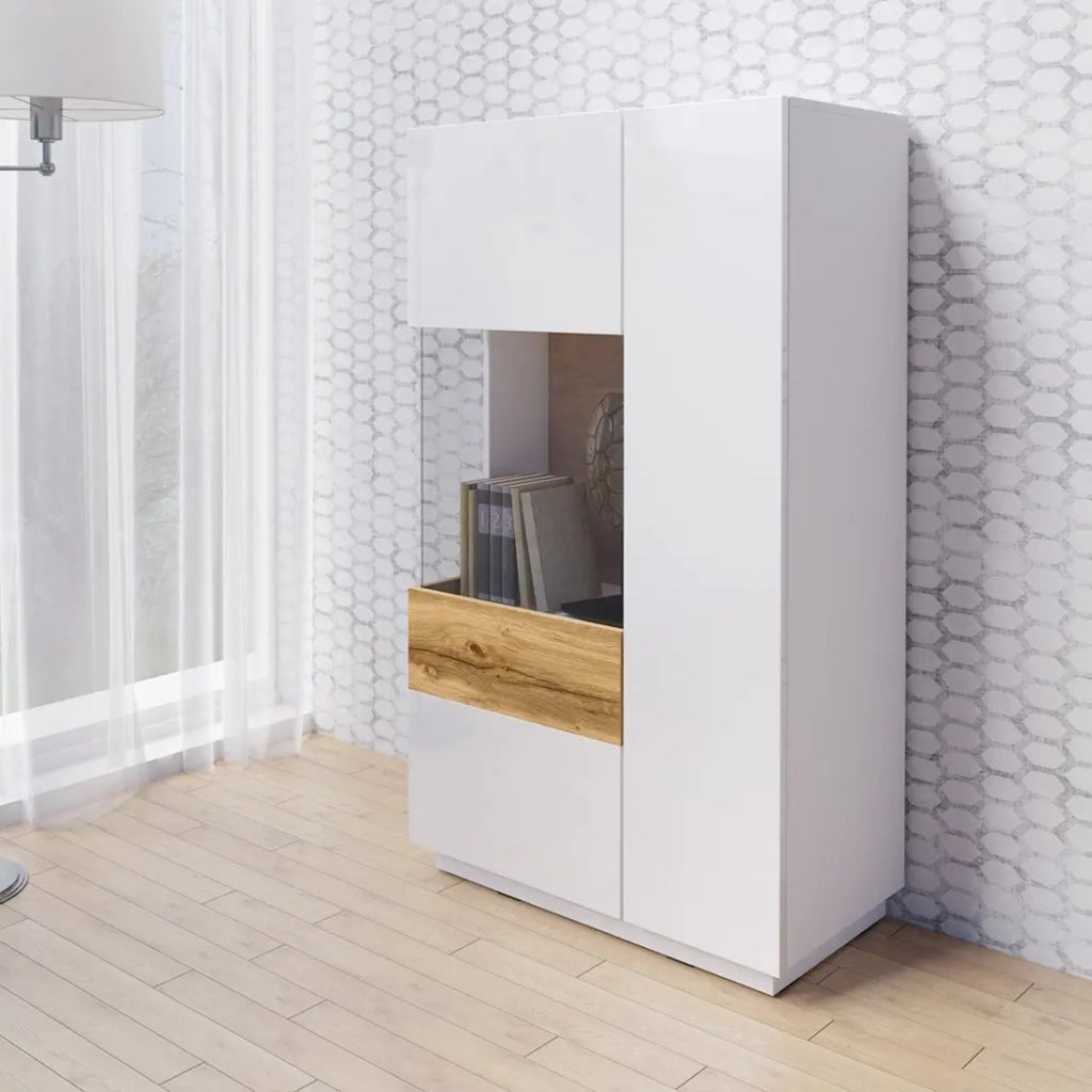 Credenza alta con LED collezione KILES a due porte. Colori bianco e rovere. Porta a vetro sulla sinistra.
