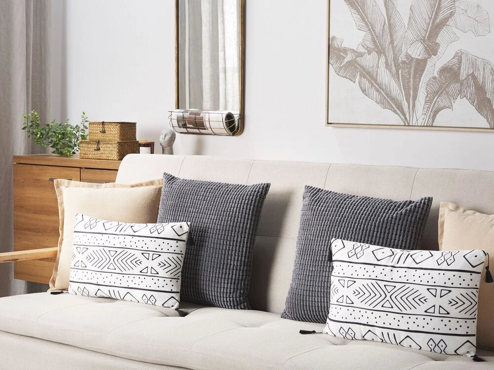 Set di 2 cuscini motivo geometrico nappe 30 x 50cm bianco e nero