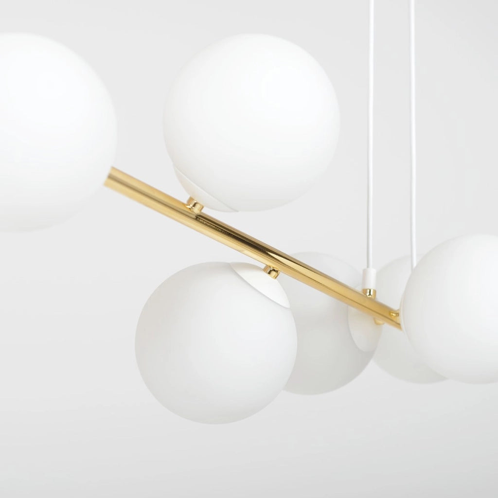 Lampada a sospensione Gravity in acciaio oro e vetro bianco