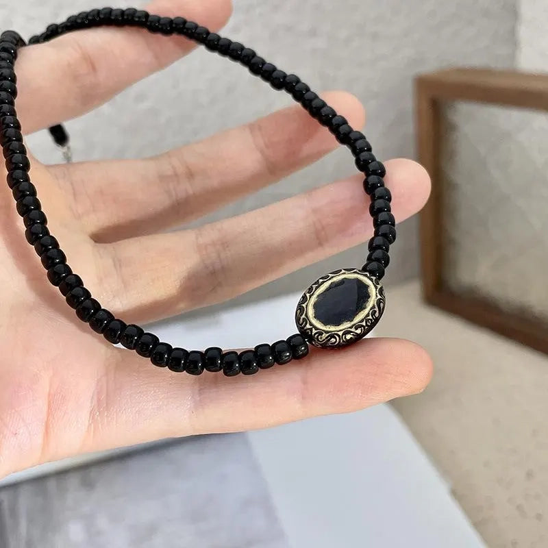 Collana vintage barocca con perline nere e oro, regalo di Natale o compleanno.