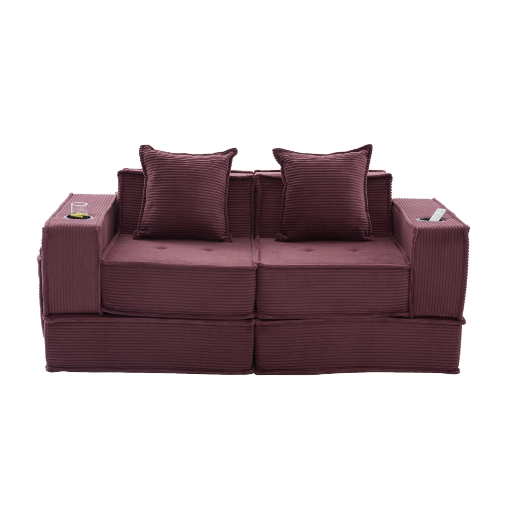 Poltrona pouf modulare con tasche laterali e 2 cuscini; seduta ampia in velluto a coste rosso vino
