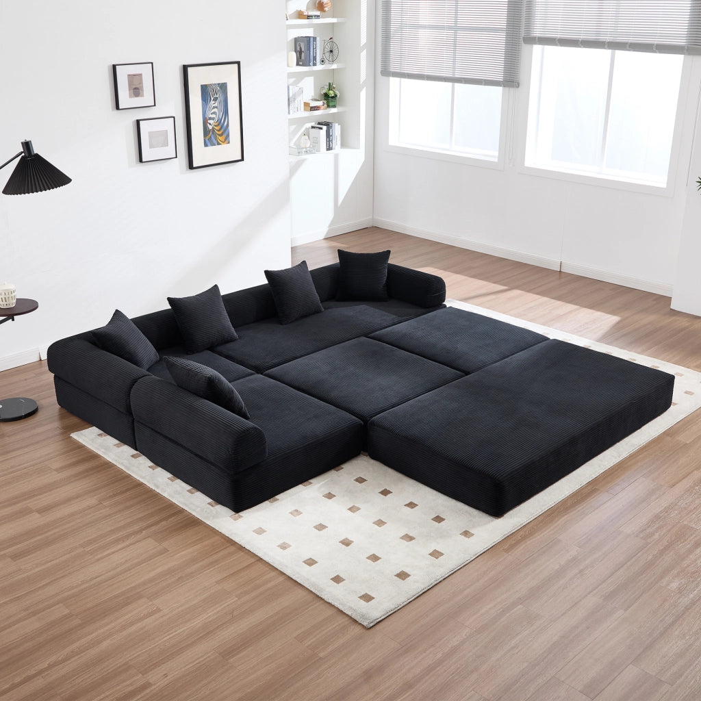 Divano modulare 270x180x64 cm trasformabile in letto con tasca laterale in velluto a coste nero