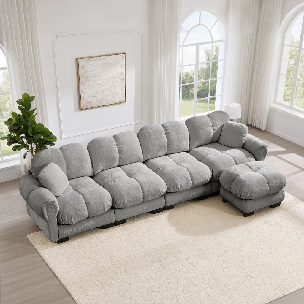 Divano angolare modulare a l con pouf mobile e cuciture trapuntate in tessuto chenille grigio chiaro 330 × 149 × 90 cm