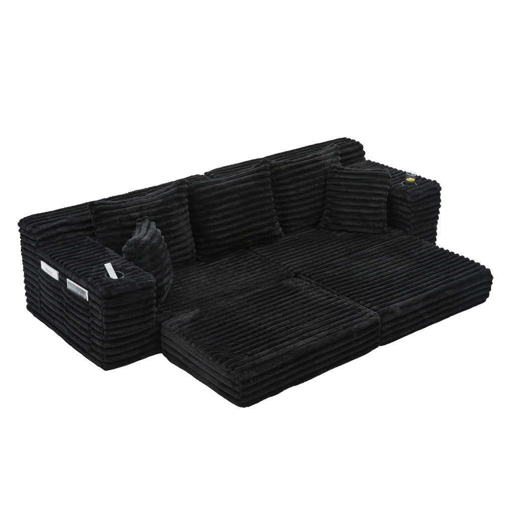 Divano in tessuto corduroy nero con schienale alto, tasche laterali, portabicchieri e funzione letto