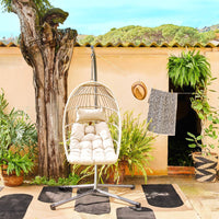 Poltrona sospesa in acciaio, rattan, poliestere, beige