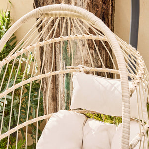 Poltrona sospesa in acciaio, rattan, poliestere, beige