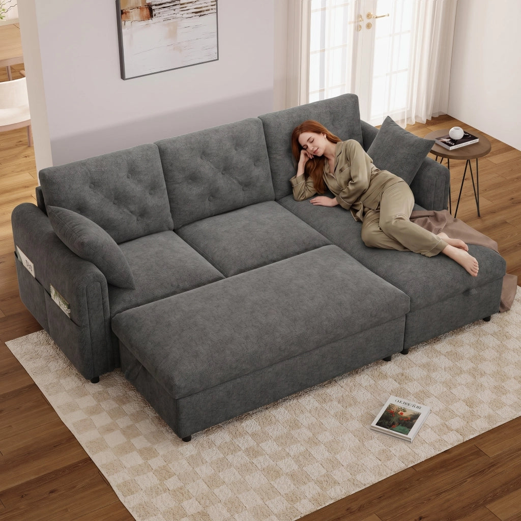 Divano angolare convertibile in velluto con chaise longue reversibile, pouf contenitore e tasche laterali grigio