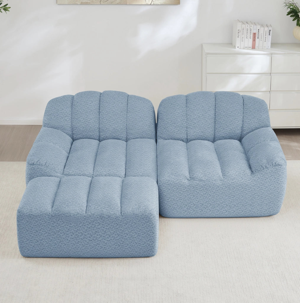Divano modulare angolare 2 posti con pouf; senza struttura; in fleece granulato blu