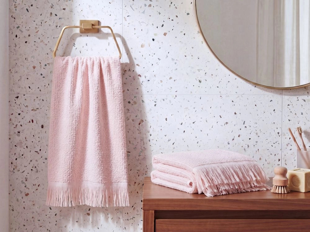 Set di 2 asciugamani bagno in spugna di cotone rosa pastello con nappe decorative