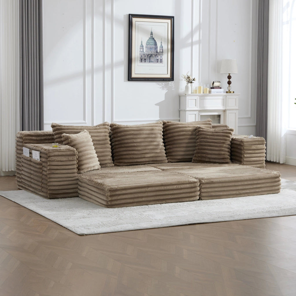 Divano in velluto a coste color khaki, schienale alto, tasche laterali e portabicchieri, modulare e trasformabile in divano letto
