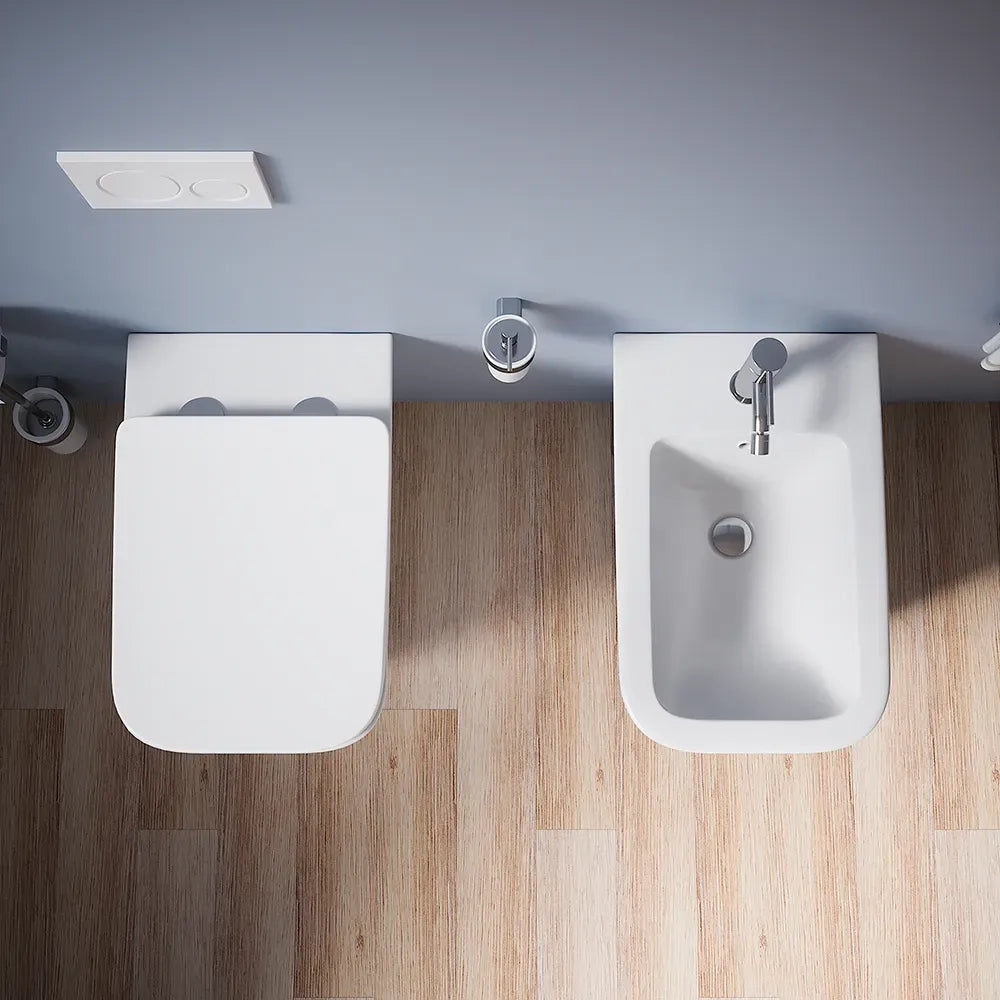 Coppia sanitari in ceramica filomuro vaso rimless, bidet e copri-wc bianco opaco | Kyoto