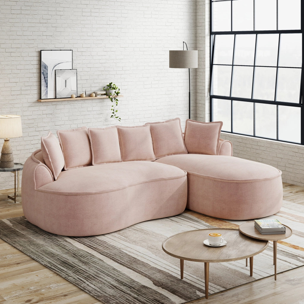 Divano modulare a L senza struttura in ciniglia con chaise longue profonda braccioli larghi e cuscini rosa