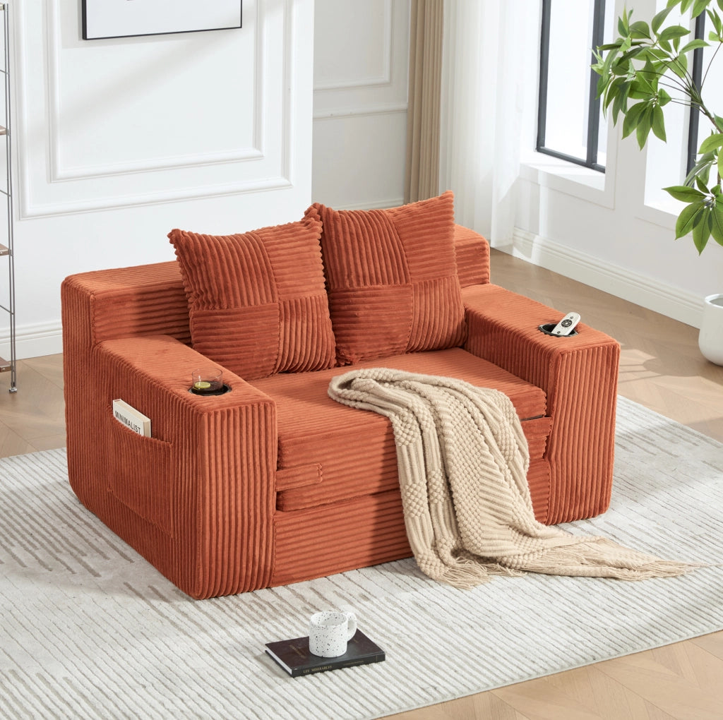 Divano pouf in velluto a coste arancione con tasche laterali e 2 cuscini; 151 x 133 x 64 cm