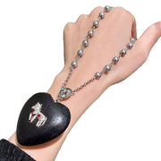 Collana con perla a forma di cuore in legno nero