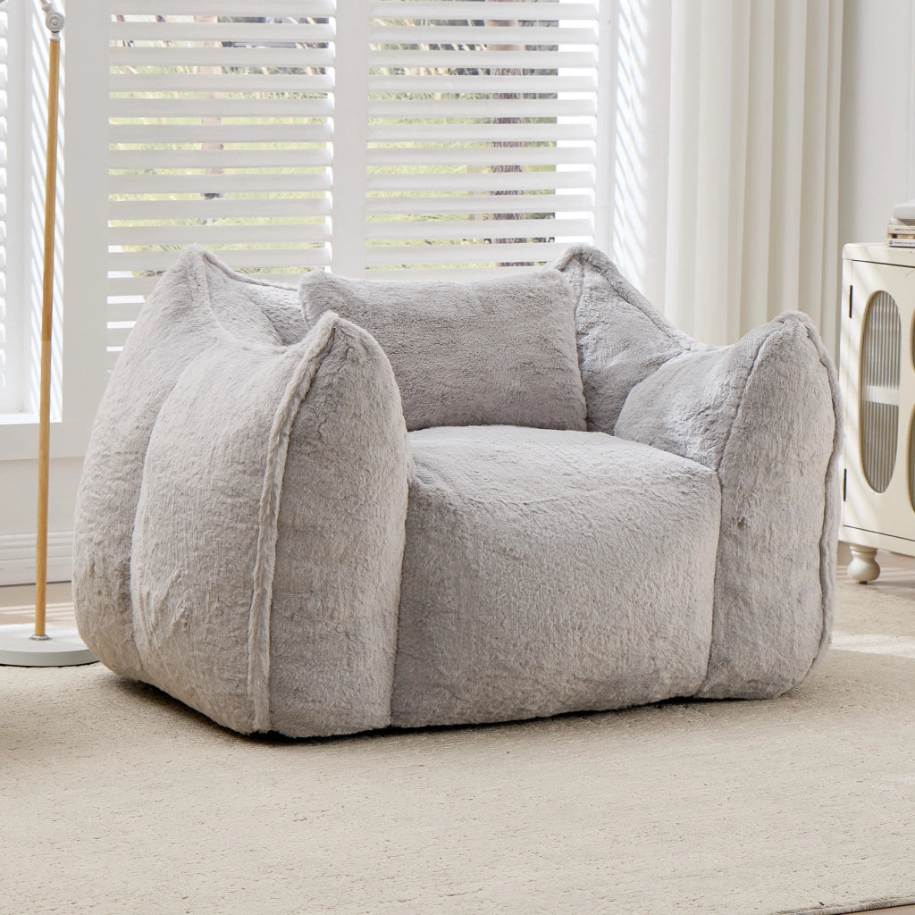 Poltrona pouf con schienale ergonomico e imbottitura in schiuma, in pelliccia sintetica grigia per soggiorno