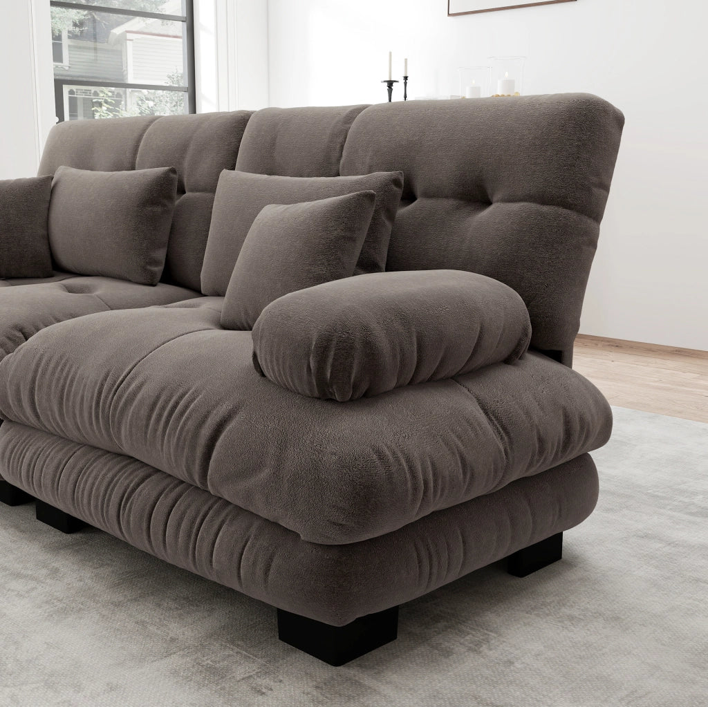 Divano modulare in chenille marrone con ottoman mobili; cuscini lombari e decorativi