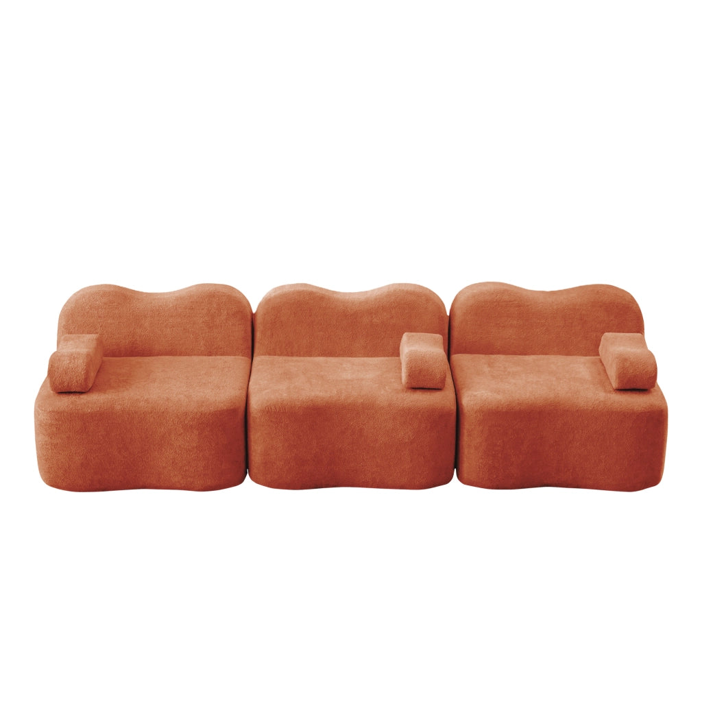 Divano modulare senza struttura con seduta profonda, schienali ergonomici e pouf collegabile in velluto arancione