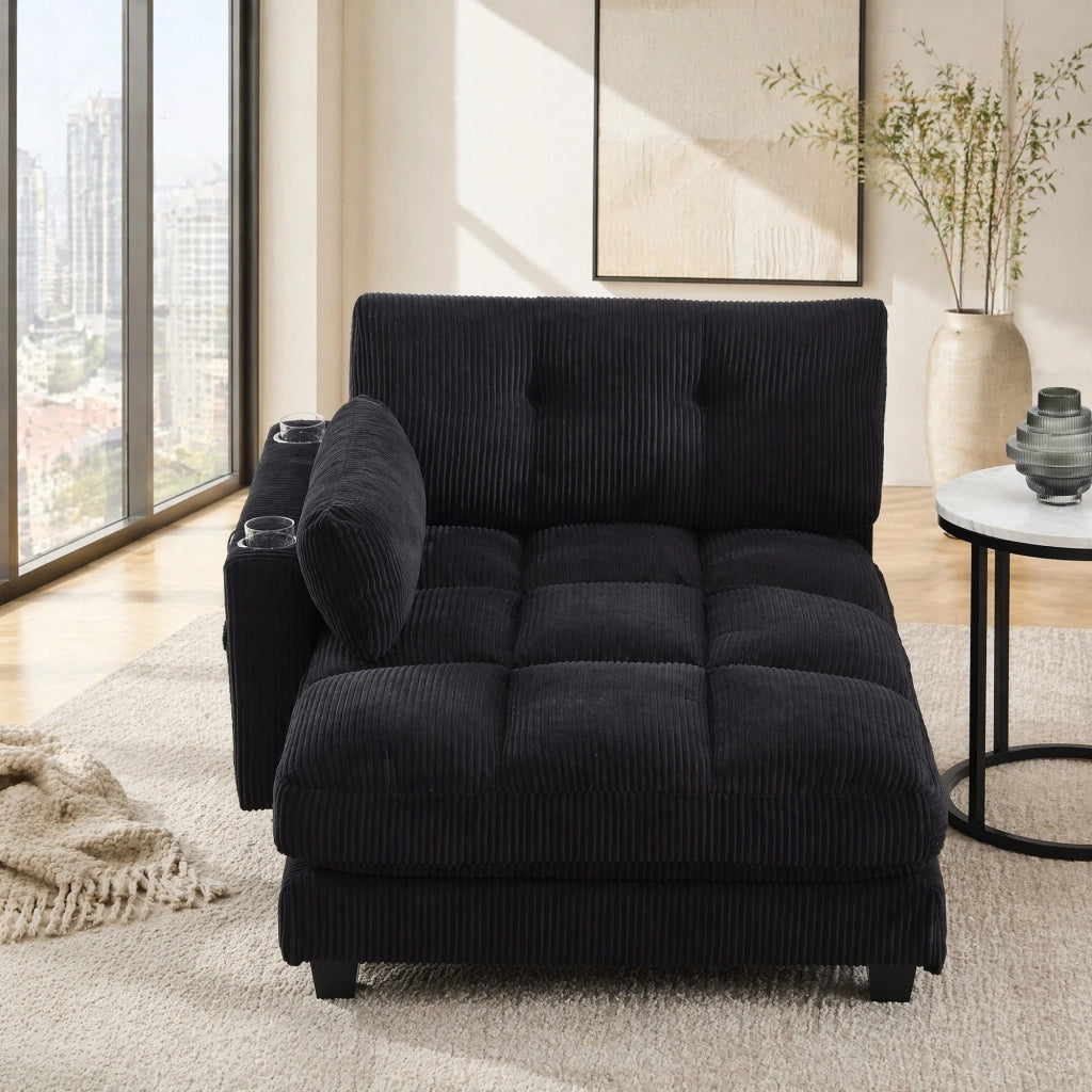 Poltrona lounge moderna in corduroy nero con porta bicchieri, tasche laterali e porte USB
