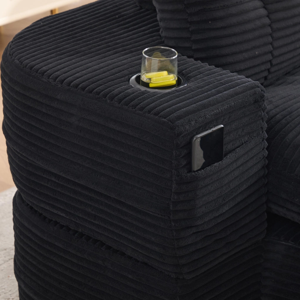 Poltrona letto 2 in 1 in corduroy nero, seduta extra profonda con schienale alto, doppi portabevande e tasche laterali