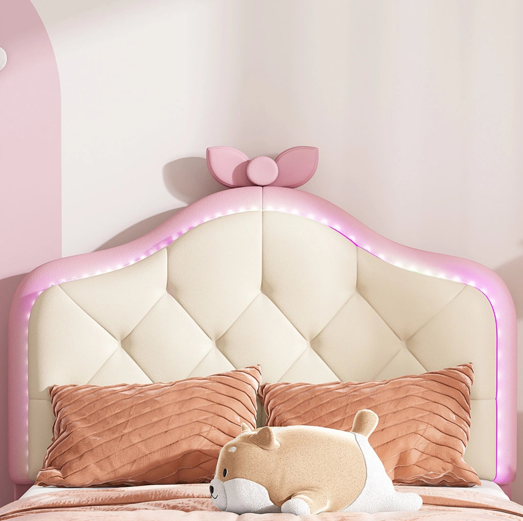 Letto singolo imbottito ULEVR 90x200 cm con LED multicolore, testiera ondulata e fiocco rosa, PU bianco e rosa