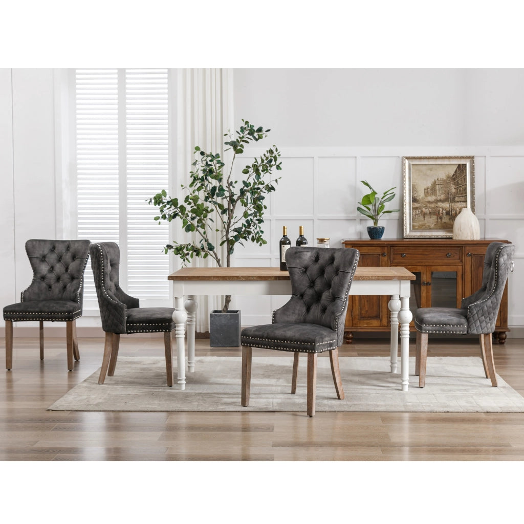 Sedia da pranzo imbottita con gambe regolabili e borchie decorative e manico posteriore in velluto grigio