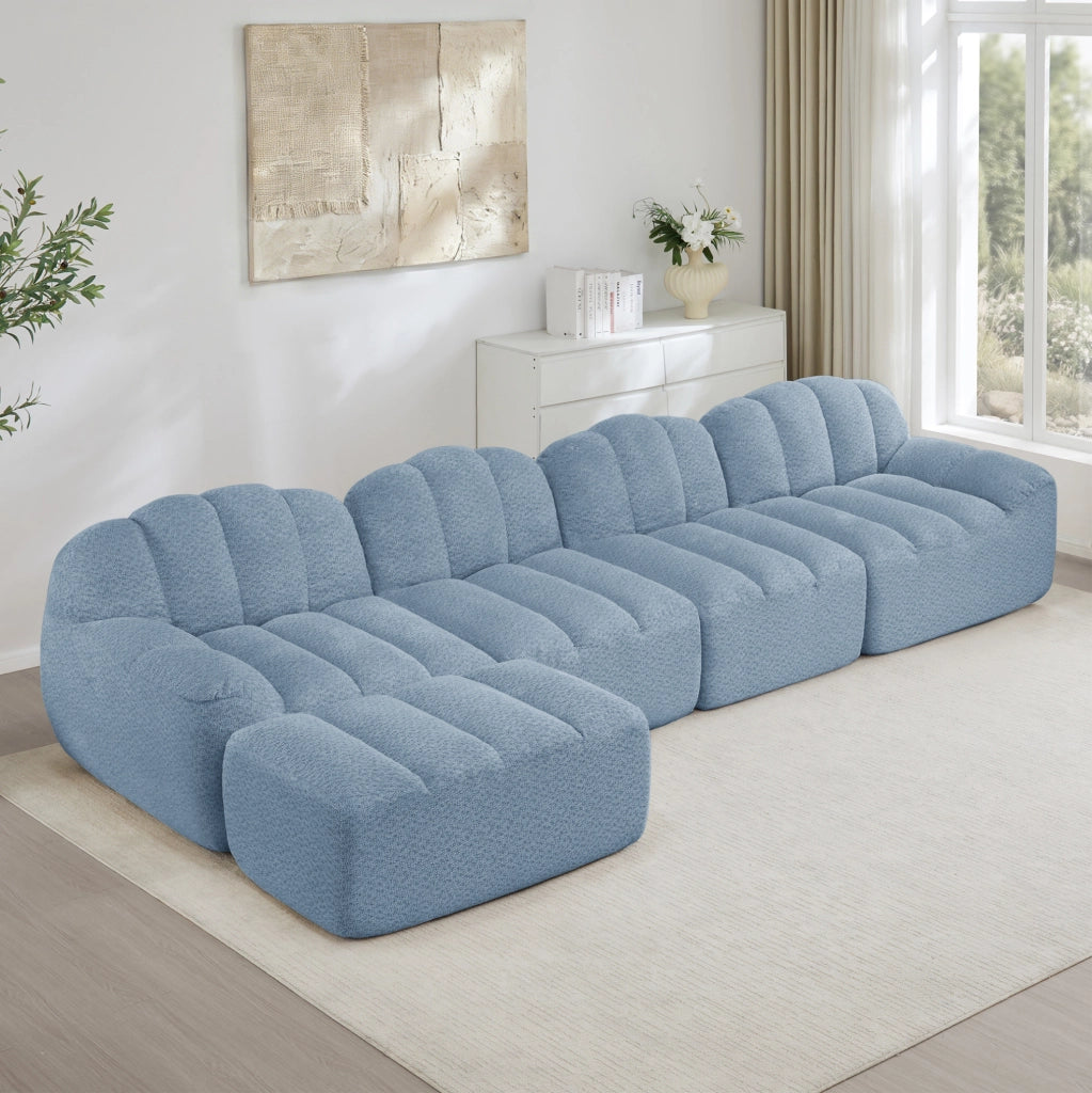 Divano modulare 4 posti con ottomana collegabile; 366x165x79 cm; pile granulato blu