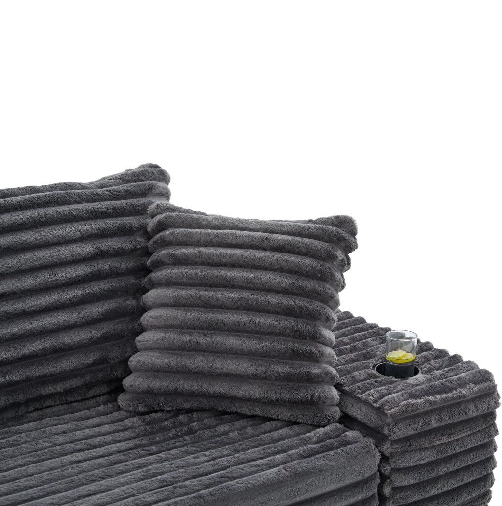 Divano in corduroy grigio scuro con schienale alto; cuscini extra; tasche laterali e portabicchieri; 273 cm