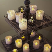 Set di 24 LED-theelichti senza fiamma in contenitore decorativo a forma di candela - Nero con disegno di cuore - Per una decorazione accogliente in casa - Incluso involucro di carta
