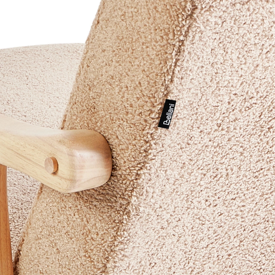 Poltrona a dondolo con rivestimento in bouclé beige gambe in legno di gomma e braccioli Soggiorno Cameretta