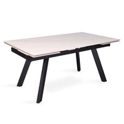 Tavolo da pranzo allungabile per 10 persone con piano in pietra bianca, collezione LAROS. Struttura in metallo.