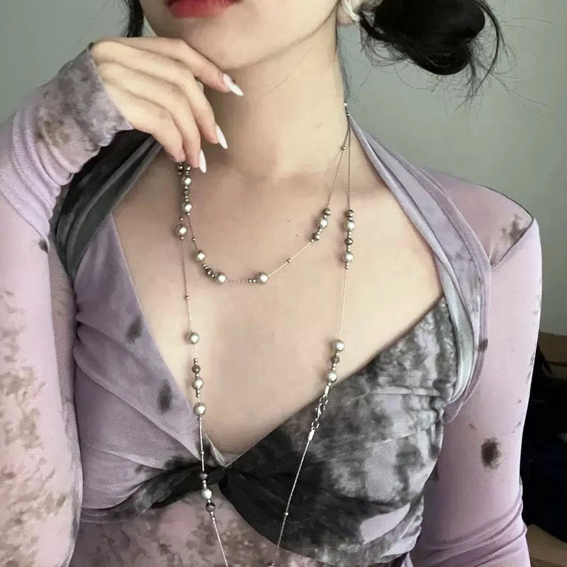 Collana lunga con stella di perle grigio argento