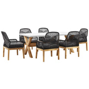 Set da esterno con tavolo in fibra di cemento grigio e 6 sedie in vimini stile moderno industriale