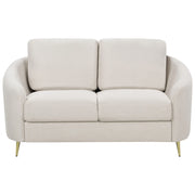 Divano 2 posti in tessuto beige chiaro con piedi dorati curve morbide stile glamour elegante soggiorno