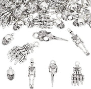 60 pezzi 4 stili Arti ossee metalliche Manopole di teschio Charmo di testa di corvo Testa di corvo Pendente in stile tibetano Pendente per chiave catenella Bracciale per gioielleria Realizzazione di gioielli Metallico