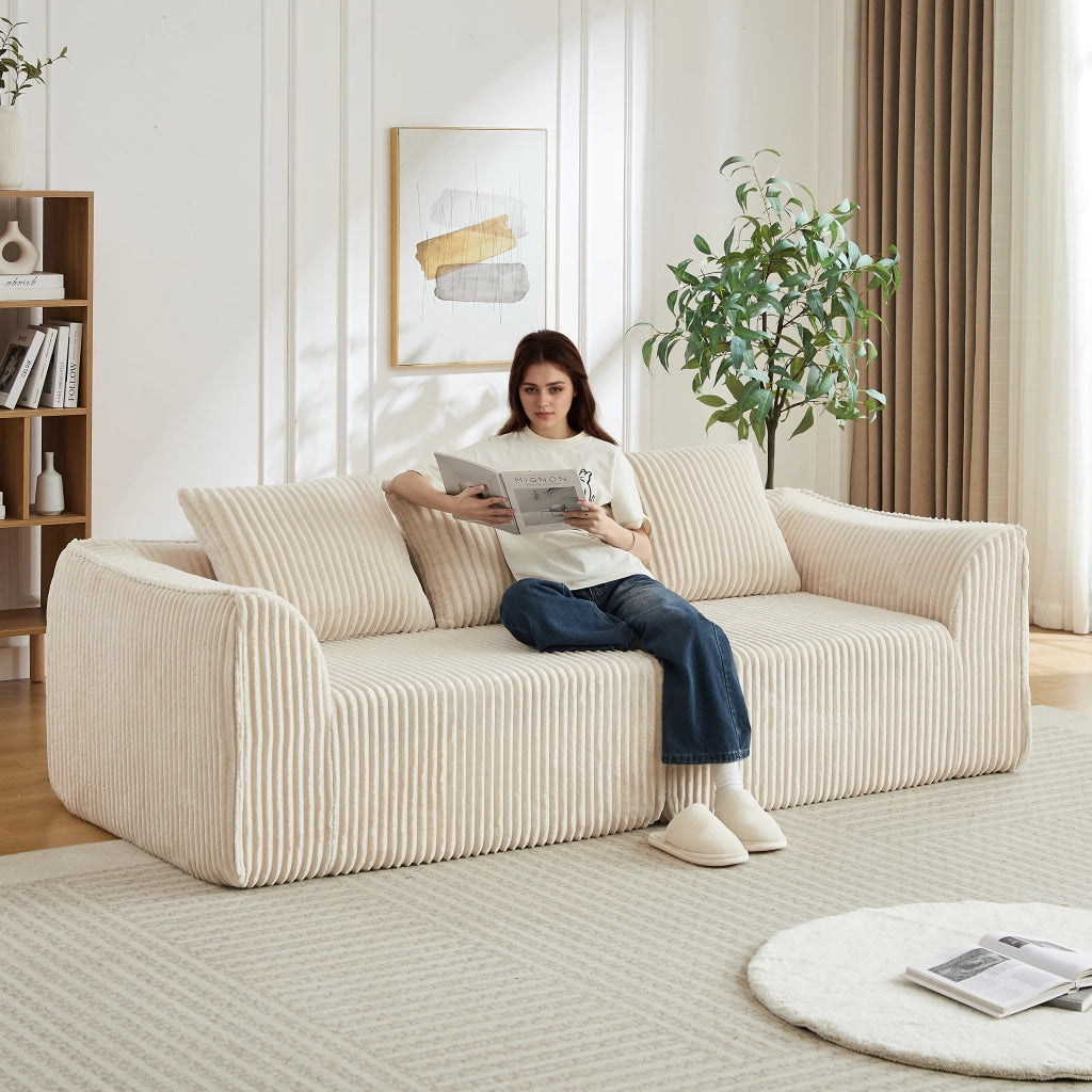 Divano modulare in ciniglia con braccioli e schienale curvi, seduta ampia e imbottitura in schiuma beige