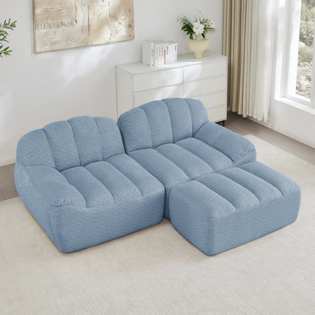 Divano angolare modulare senza struttura con ottomano e seduta ampia in pile granulato blu 210 × 165 × 79 cm